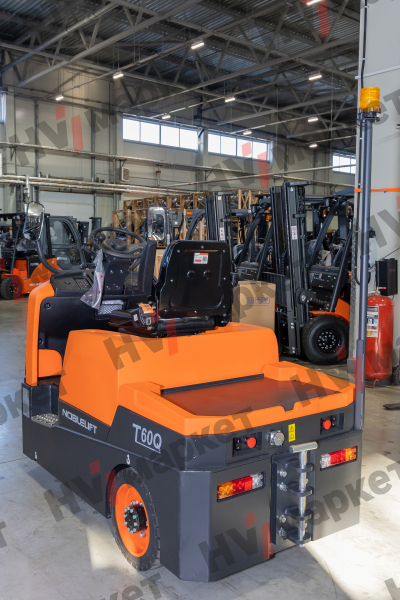 Самоходный Тягач для склада/производства T60Q 6000kg Sit-on tow tractor, standard with AB 48/400+ 48/55, with blue light and rearview mirror, and walkie mode button, optional Controller Curtis F4A and display, Seat armrest , Color: Orange & grey HV Market